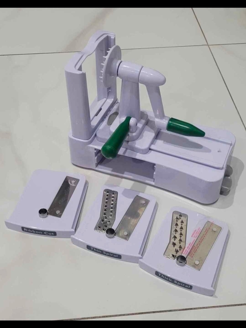 White and Green Handheld Spiralizer with 3 Blade Attachments
